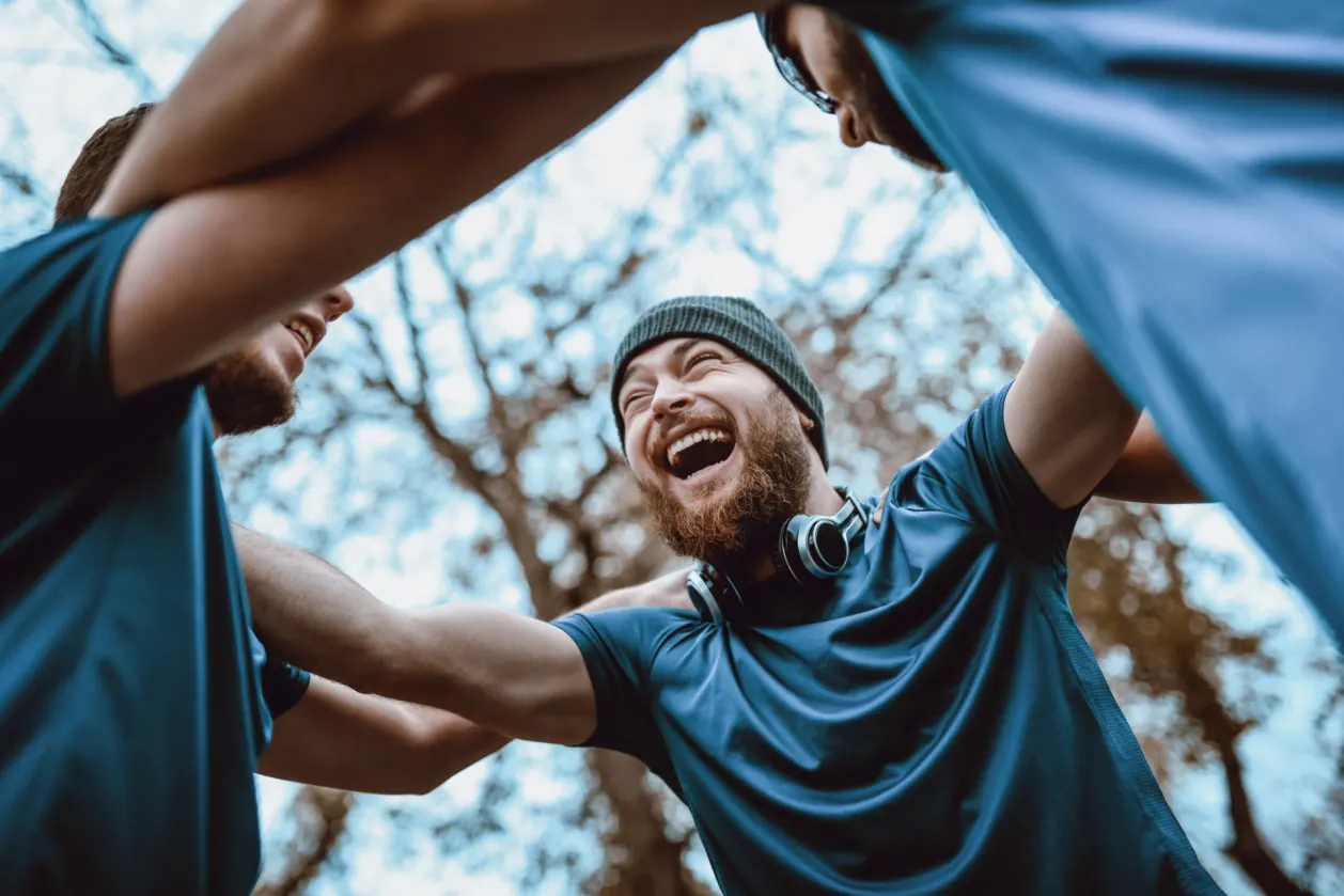 group of guys celebrating after sports day